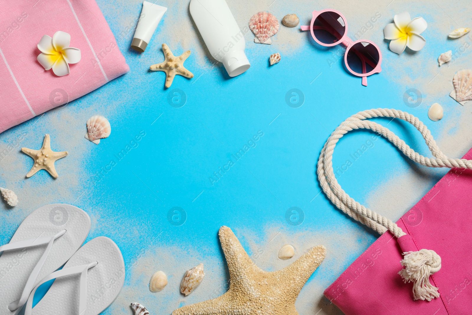 Photo of Flat lay composition with beach accessories on color background, space for text