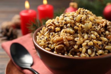 Photo of Traditional Christmas slavic dish kutia in bowl, closeup