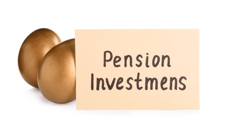 Photo of Many golden eggs and card with phrase Pension Investment on white background