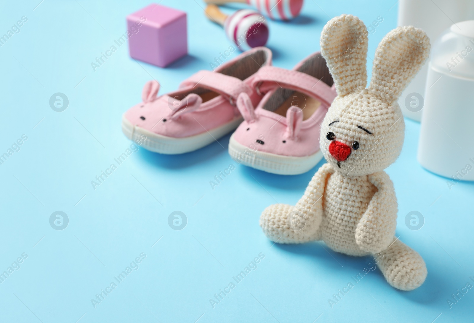 Photo of Baby accessories and toy on color background. Space for text