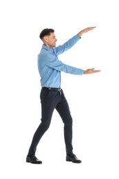 Man in office wear holding something on white background