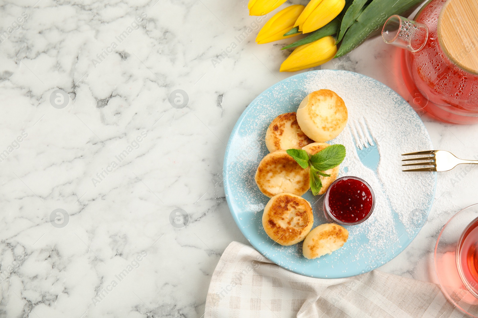 Photo of Delicious cottage cheese pancakes with jam and icing sugar on white marble table, flat lay. Space for text