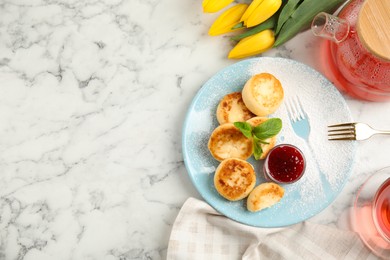 Photo of Delicious cottage cheese pancakes with jam and icing sugar on white marble table, flat lay. Space for text