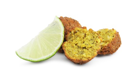 Photo of Delicious falafel balls and lime slice isolated on white