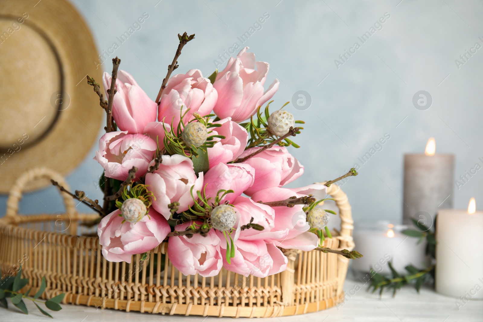 Photo of Beautiful bouquet with spring pink tulips on table