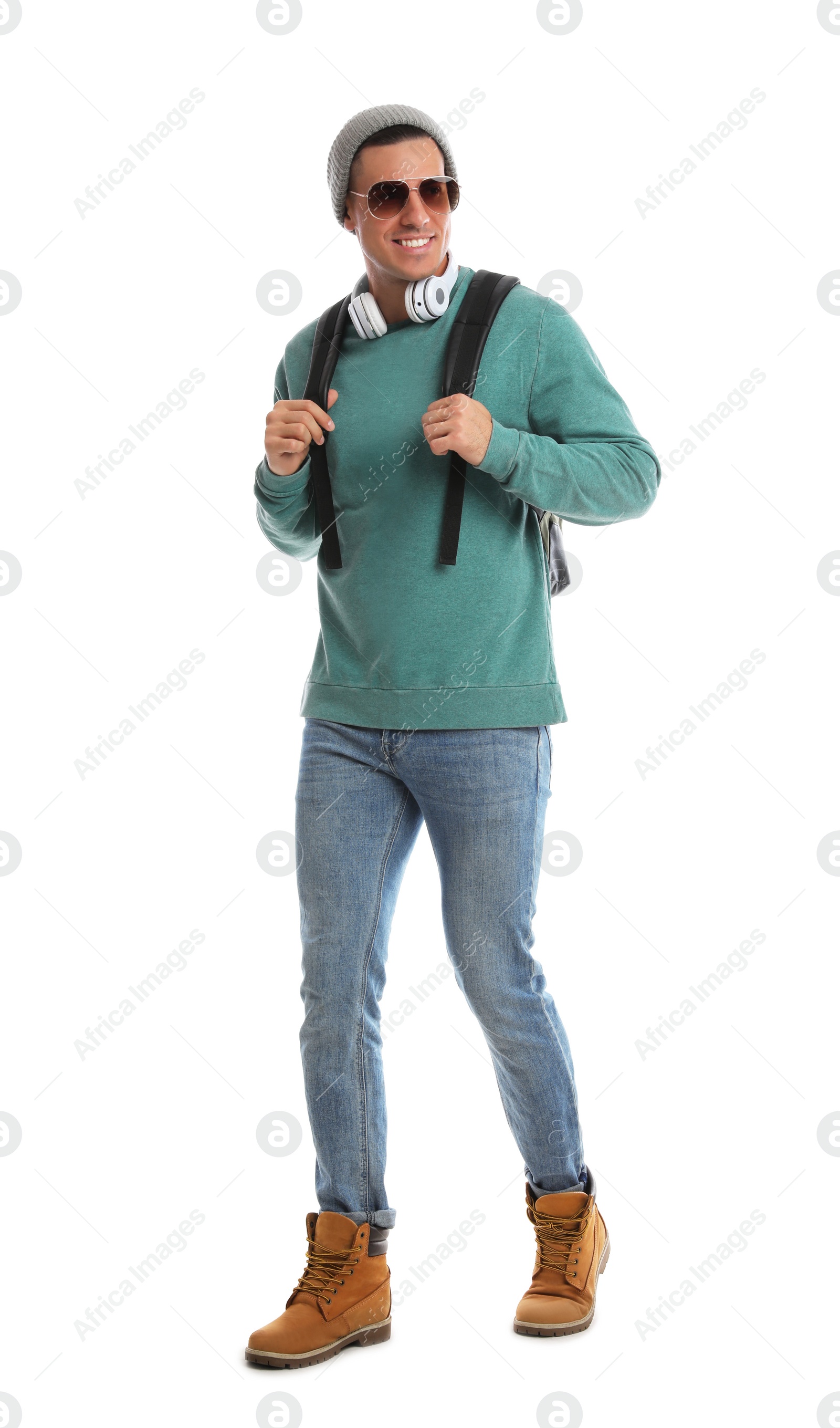 Photo of Man with backpack walking on white background. Autumn travel