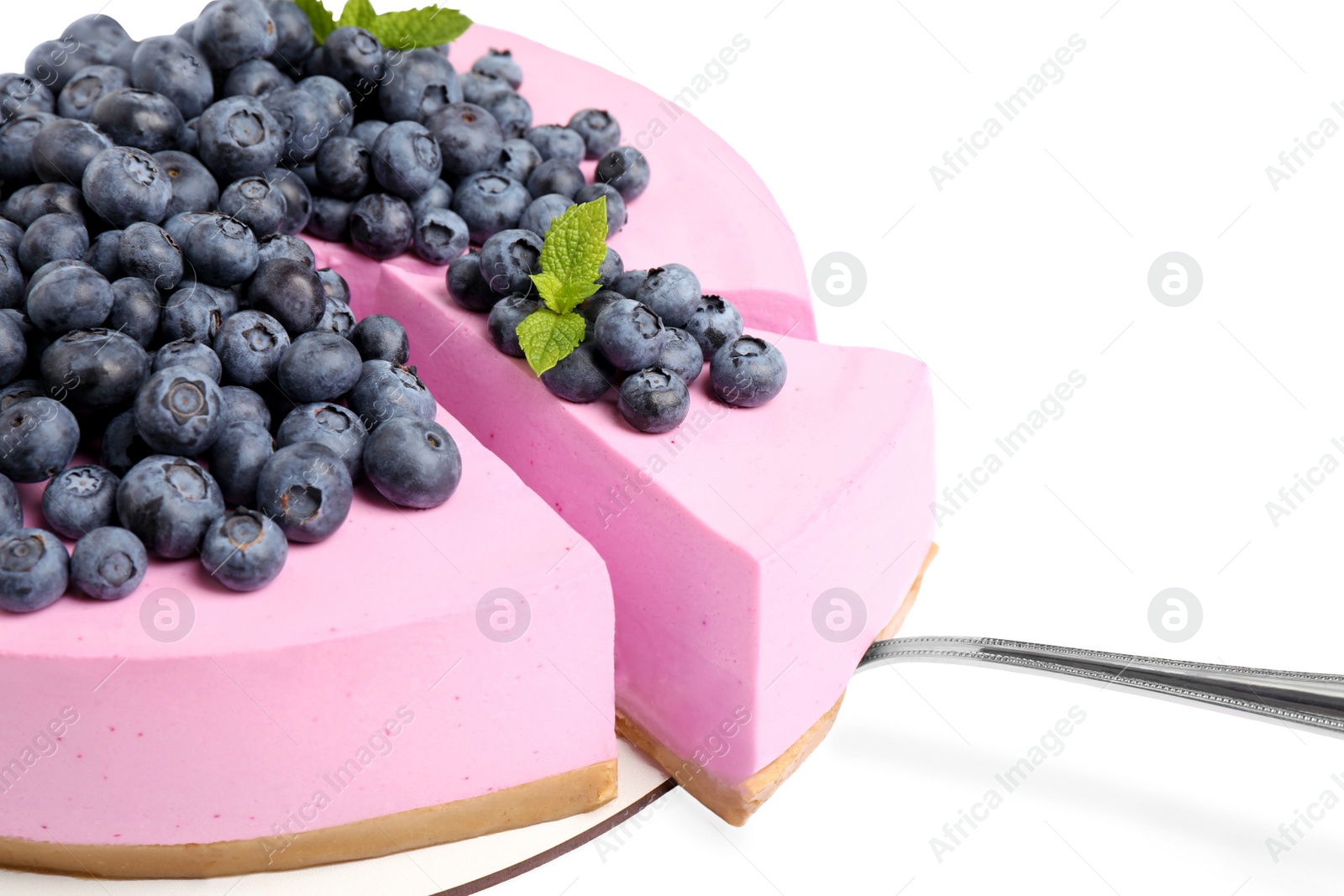 Photo of Cut tasty blueberry cake and shovel on white background, closeup