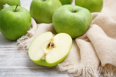 Fresh green apples on wooden table