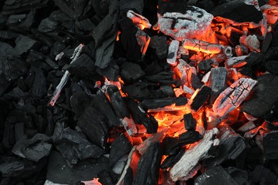 Many smoldering coals as background, top view