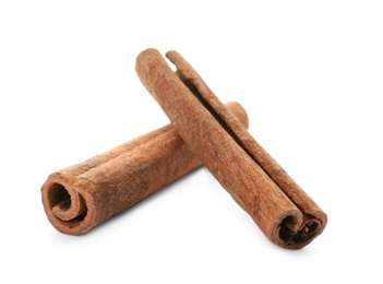 Photo of Aromatic cinnamon sticks on white background