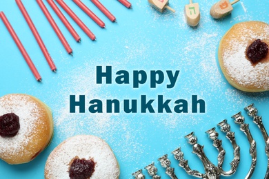 Image of Happy Hanukkah. Traditional menorah, candles, sufganiyot and dreidels on light blue background, flat lay 