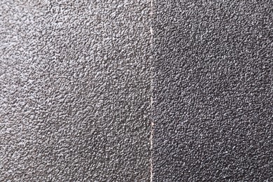 Photo of Sheets of coarse sandpaper as background, top view