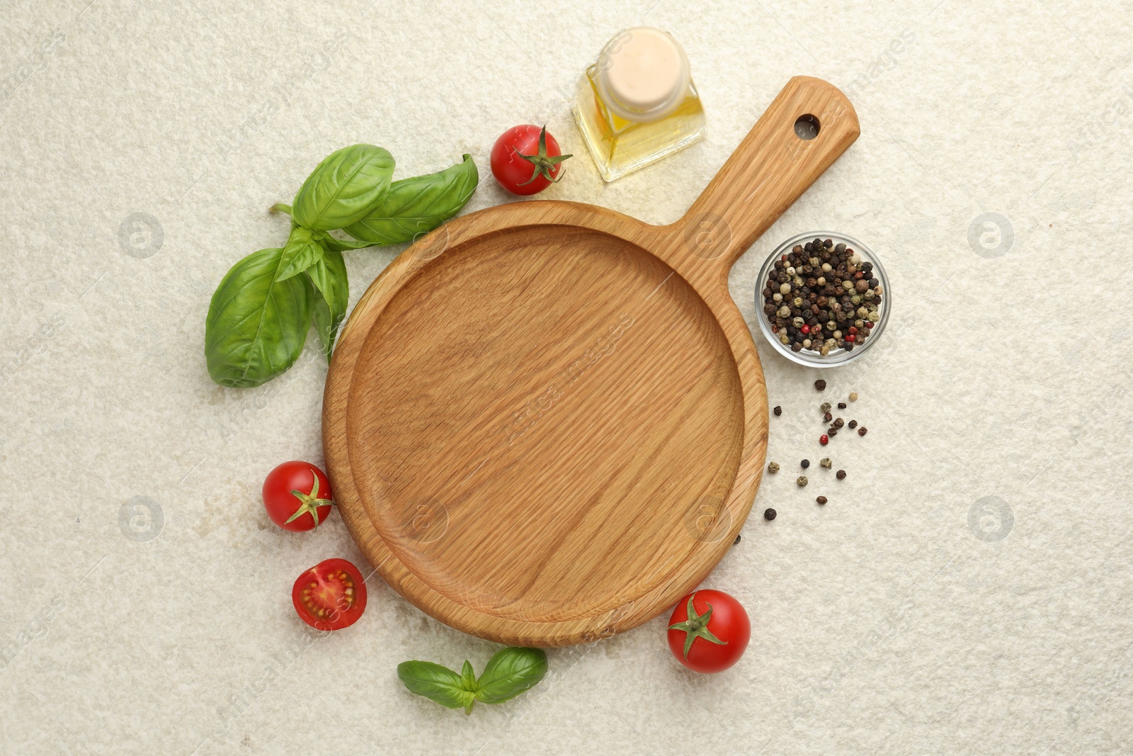 Photo of Cutting board, basil, oil, spices and tomatoes on white textured table, flat lay. Space for text