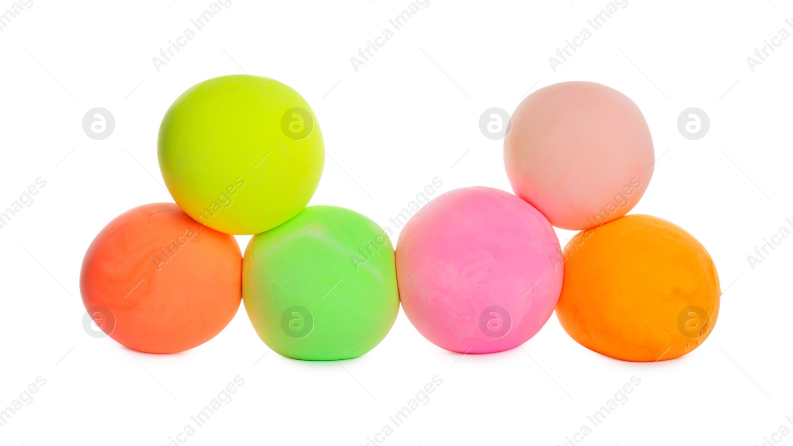 Photo of Different color play dough balls isolated on white