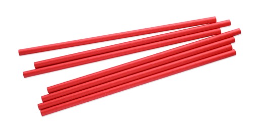 Photo of Red paper cocktail straws on white background, top view