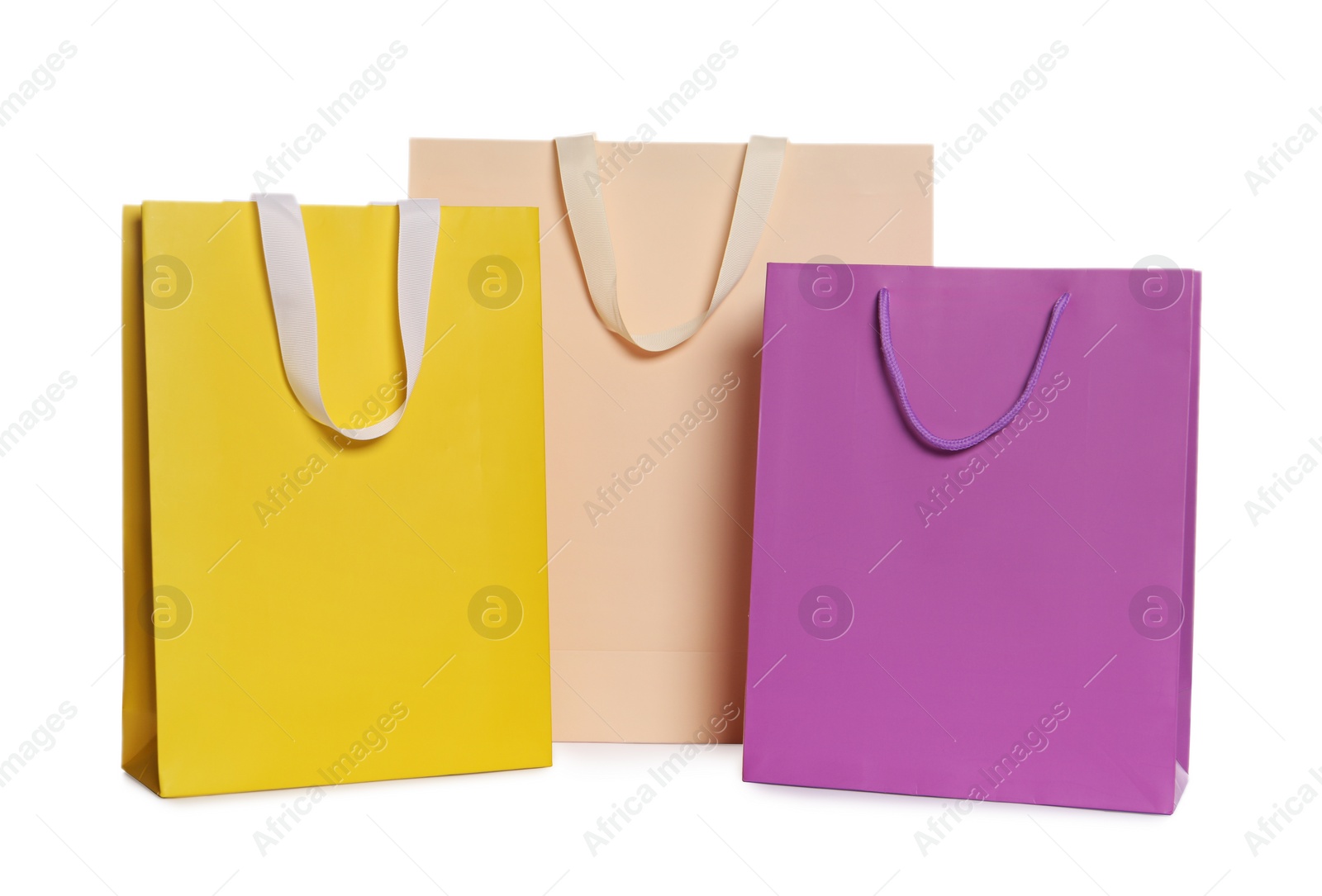 Photo of Colorful paper shopping bags isolated on white