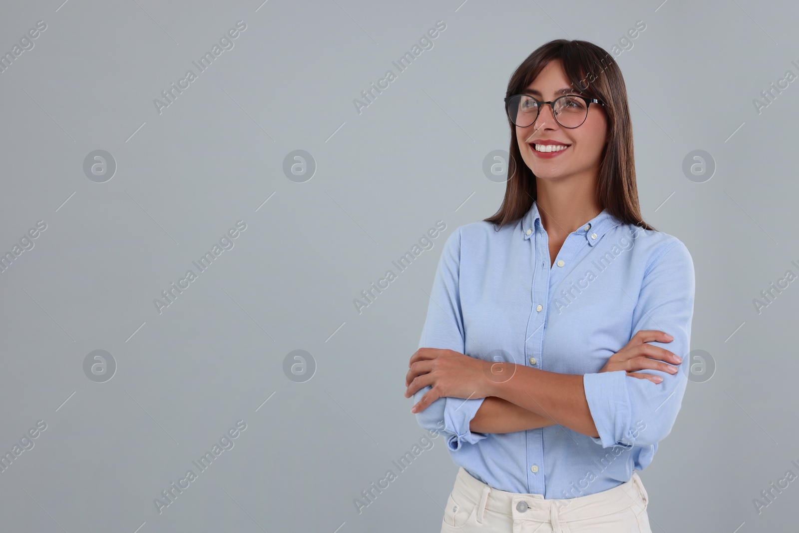 Photo of Portrait of happy secretary on light grey background. Space for text