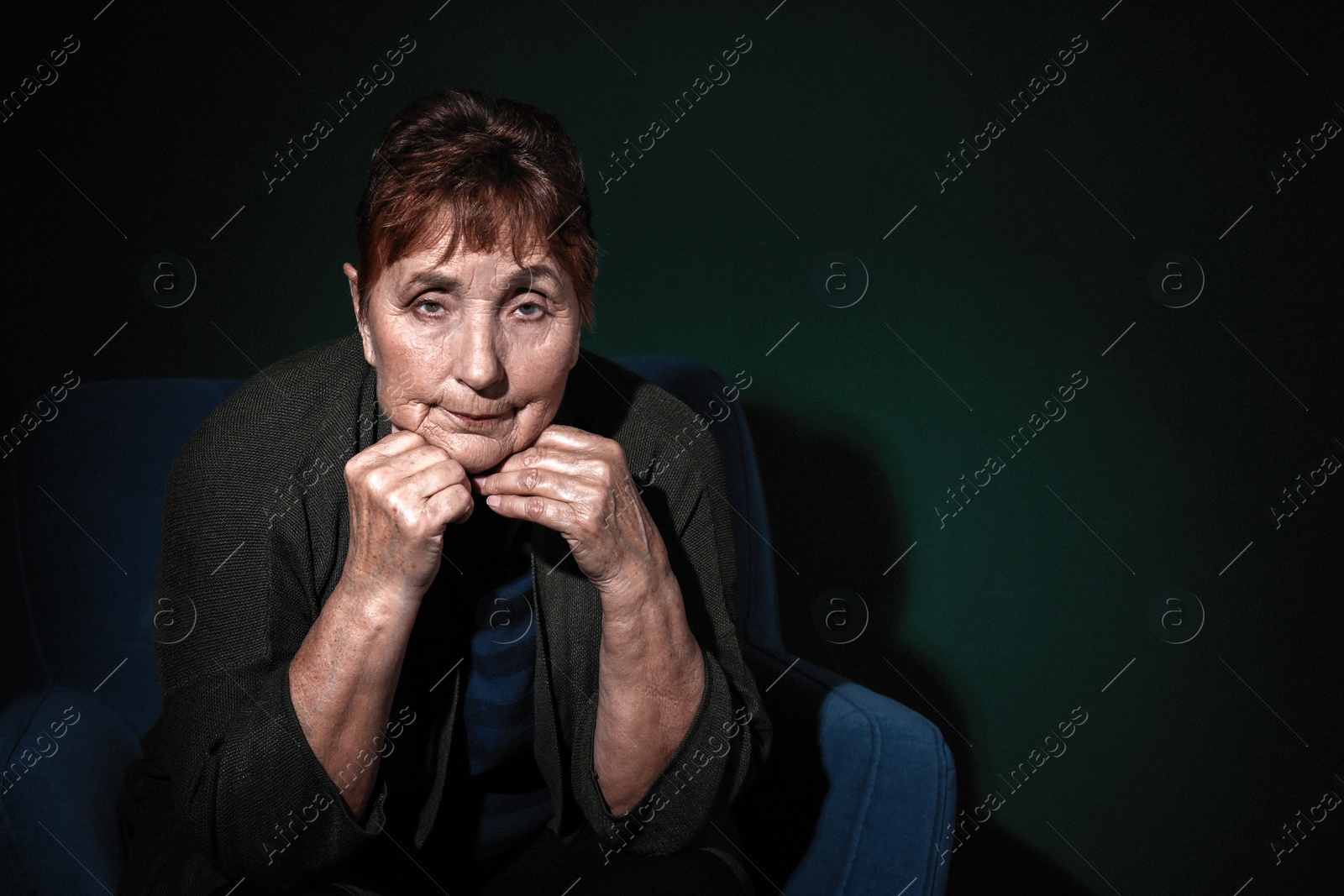 Photo of Portrait of poor senior woman on color background. Space for text