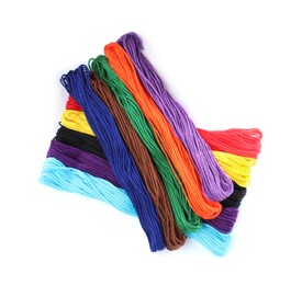 Set of colorful embroidery threads on white background, top view