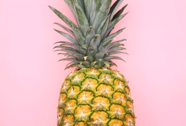 Photo of Delicious ripe pineapple on pink background, top view