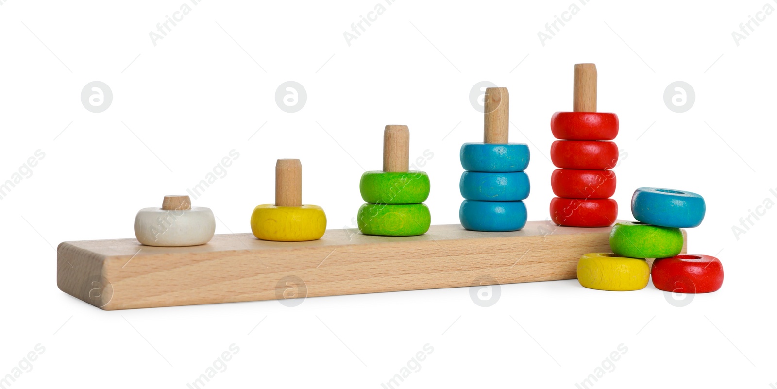 Photo of Stacking and counting game wooden pieces isolated on white. Educational toy for motor skills development