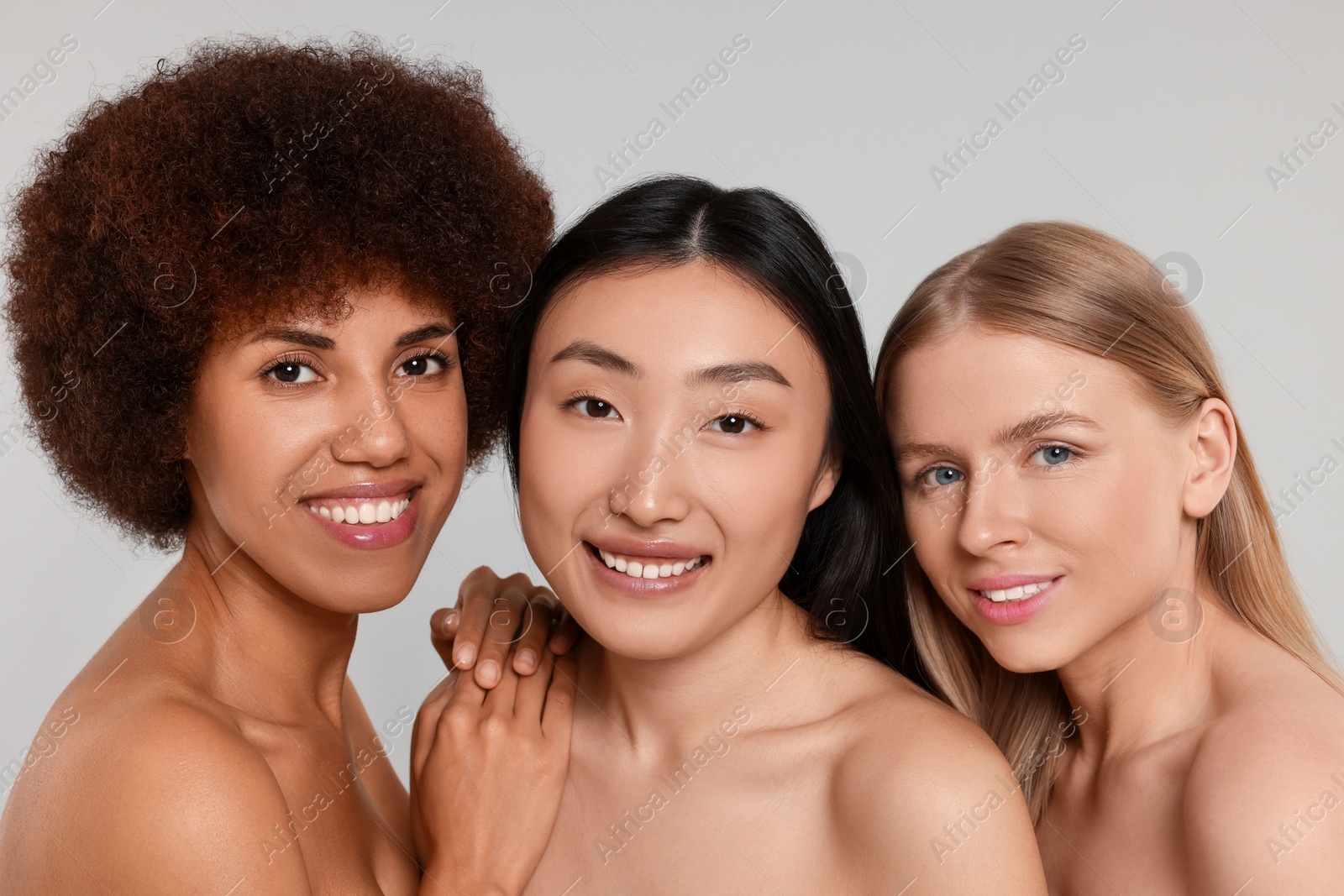 Photo of Portrait of beautiful young women on light grey background