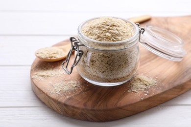 Beer yeast flakes on white wooden table, closeup