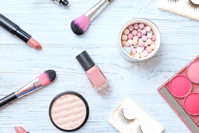 Flat lay composition with cosmetic products on wooden background