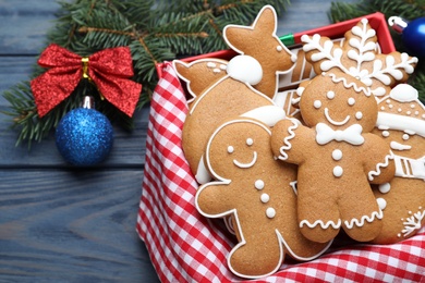 Decorated Christmas cookies on blue wooden table, closeup