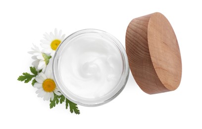 Photo of Jar of hand cream and chamomiles on white background, top view