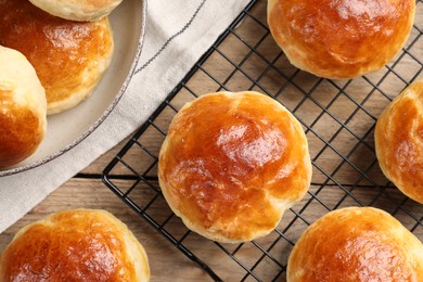 Tasty scones prepared on soda water on wooden table, flat lay