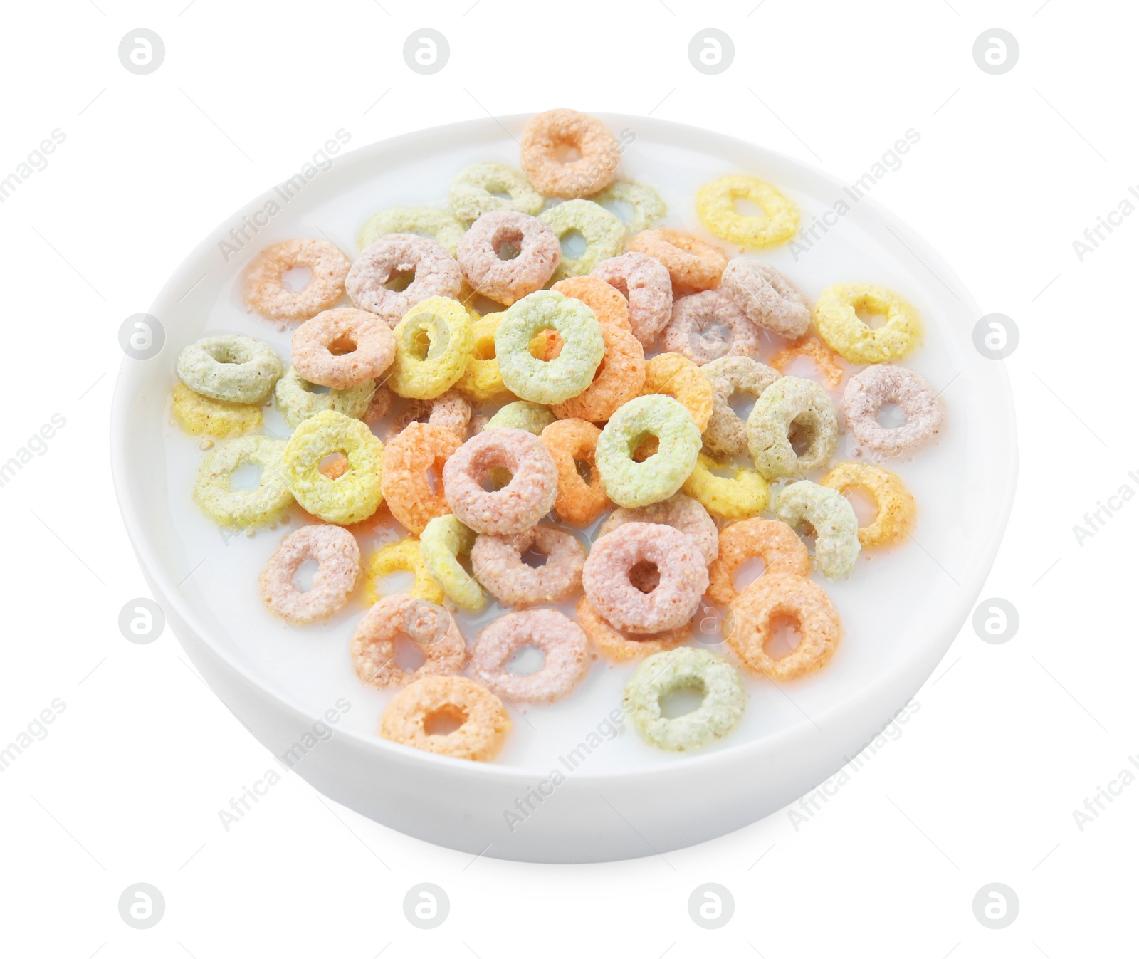 Photo of Tasty colorful cereal rings and milk in bowl isolated on white