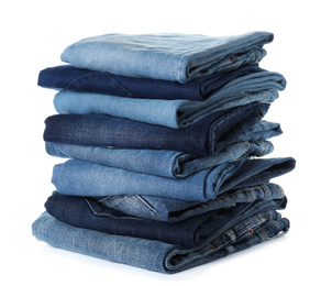 Stack of different jeans isolated on white