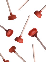 Image of Plungers with wooden handles falling on white background