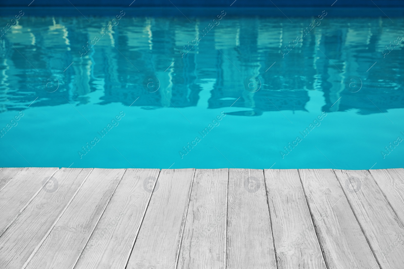 Photo of Modern swimming pool outdoors on sunny day. Space for text