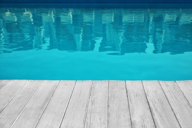 Photo of Modern swimming pool outdoors on sunny day. Space for text