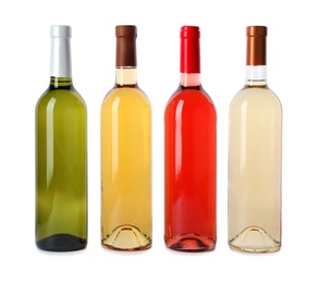 Bottles of expensive wines on white background