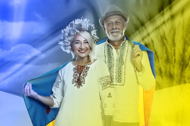 Multiple exposure of happy mature couple wearing national clothes, wheat spikes and Ukrainian flag