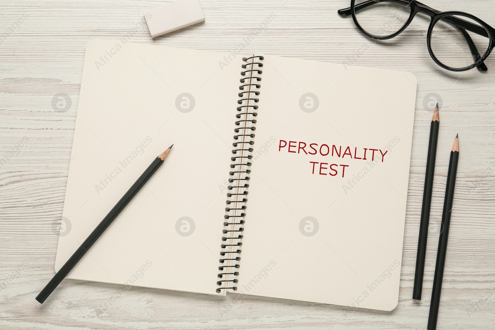 Image of Notebook with text Personality Test on white wooden table, flat lay