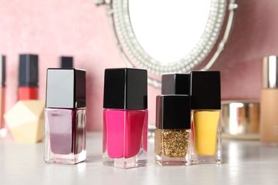 Bottles of nail polish on dressing table