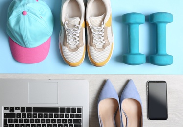 Photo of Flat lay composition with business items and sport accessories on color background. Concept of balance between work and life