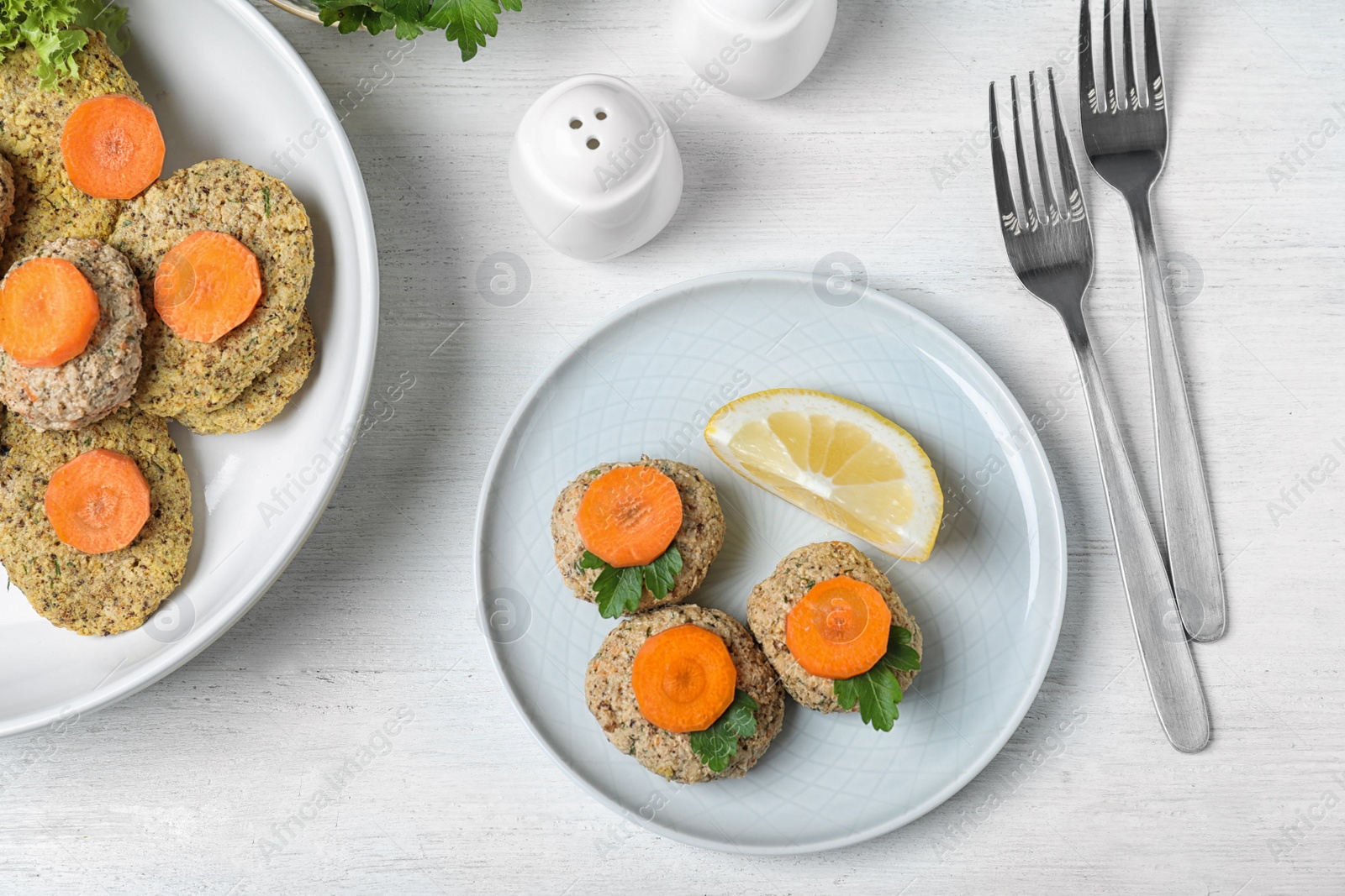 Photo of Flat lay composition with traditional Passover (Pesach) gefilte fish on wooden background