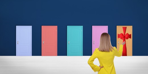Woman standing in front of many colorful doors, back view. Banner design