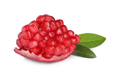 Piece of ripe juicy pomegranate and green leaves on white background