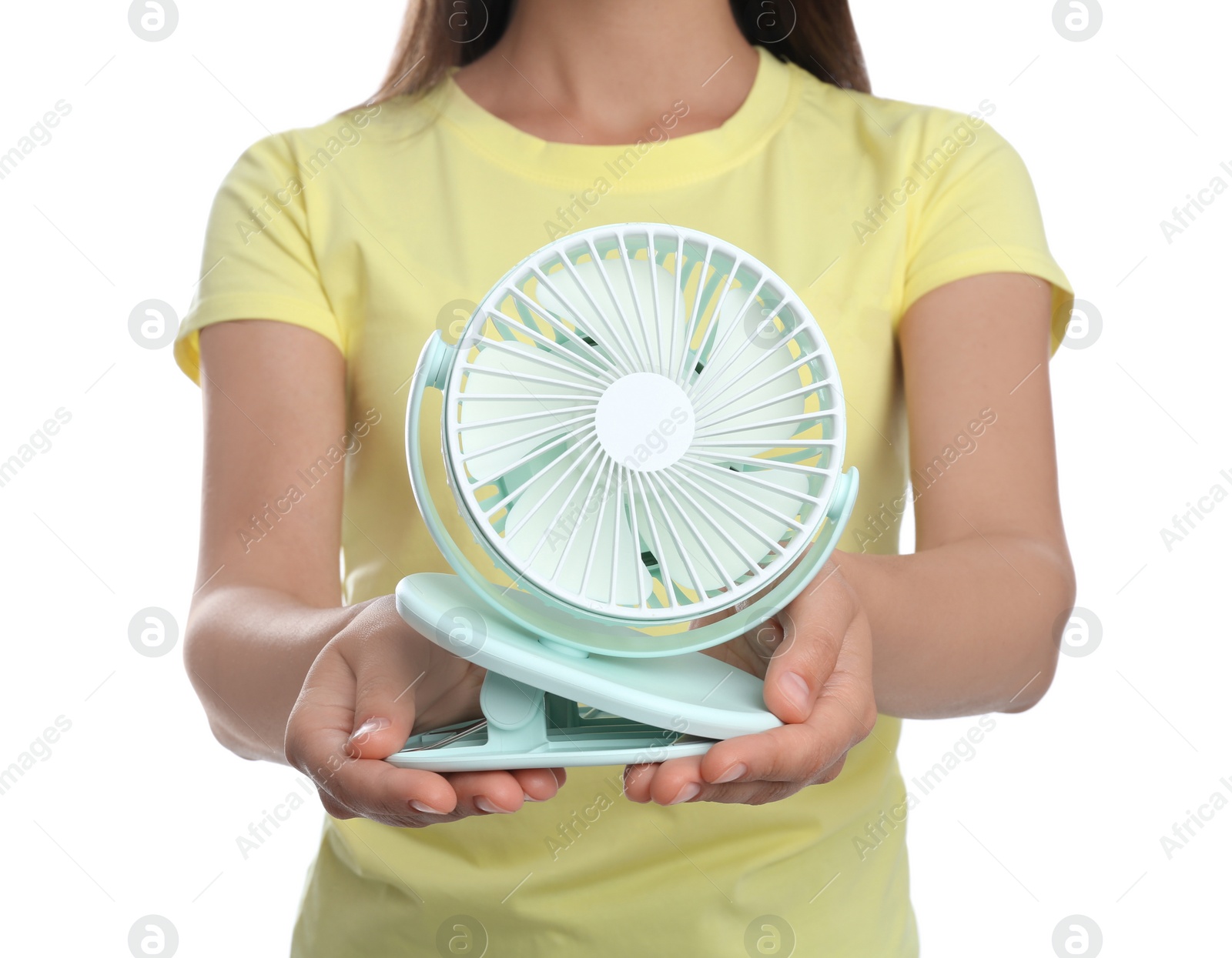 Photo of Woman with portable fan on white background, closeup. Summer heat