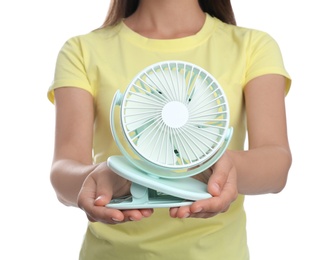 Photo of Woman with portable fan on white background, closeup. Summer heat