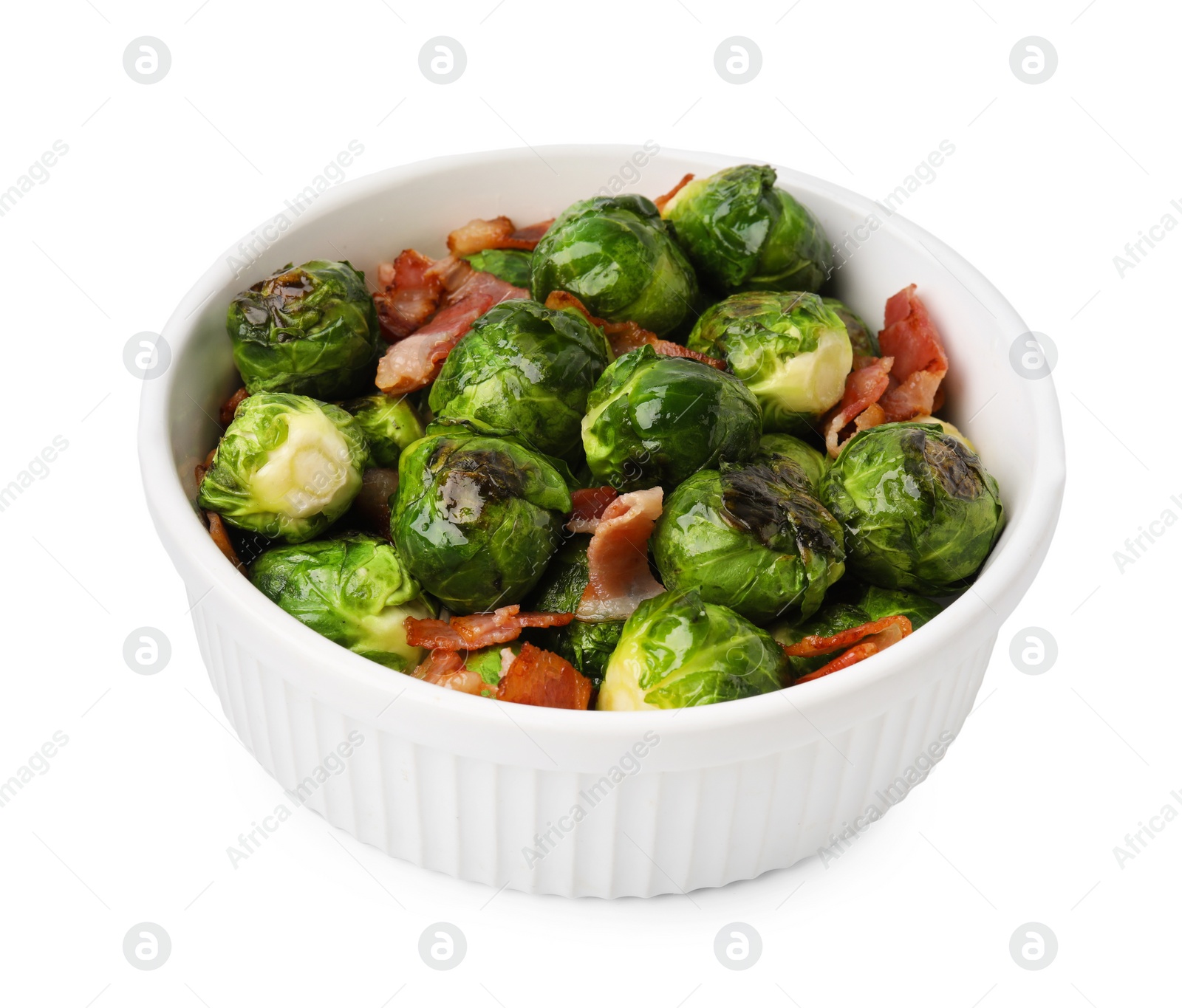 Photo of Delicious roasted Brussels sprouts and bacon in bowl isolated on white