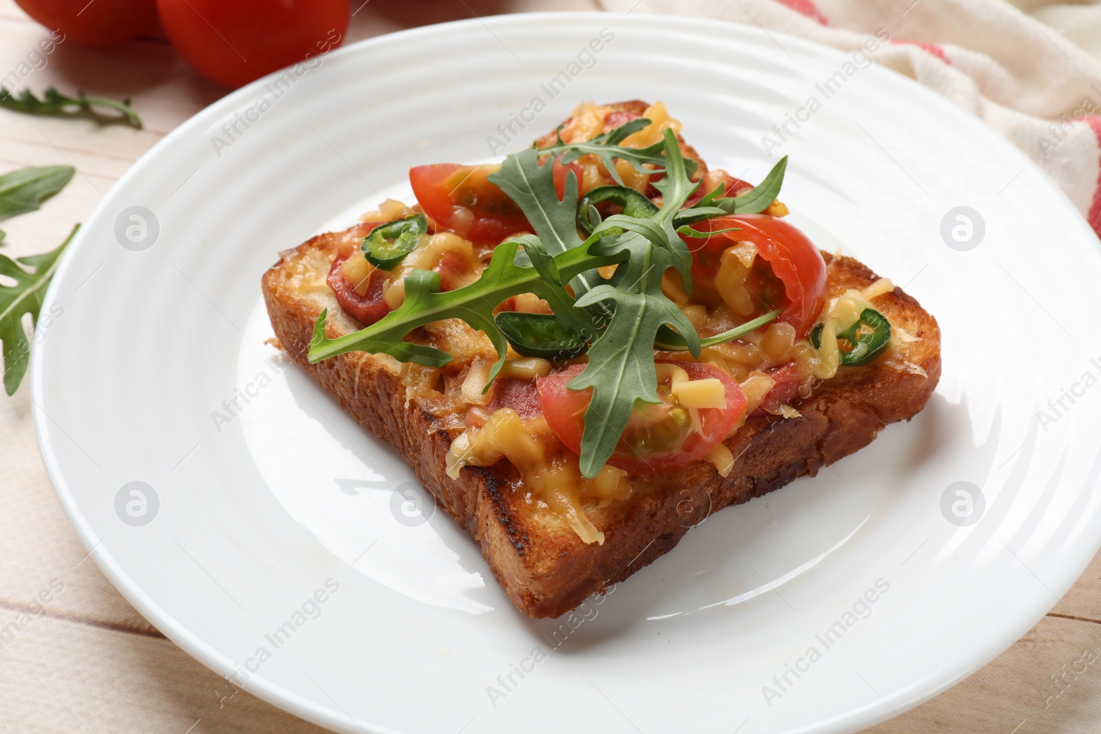 Photo of Tasty pizza toast on light wooden table