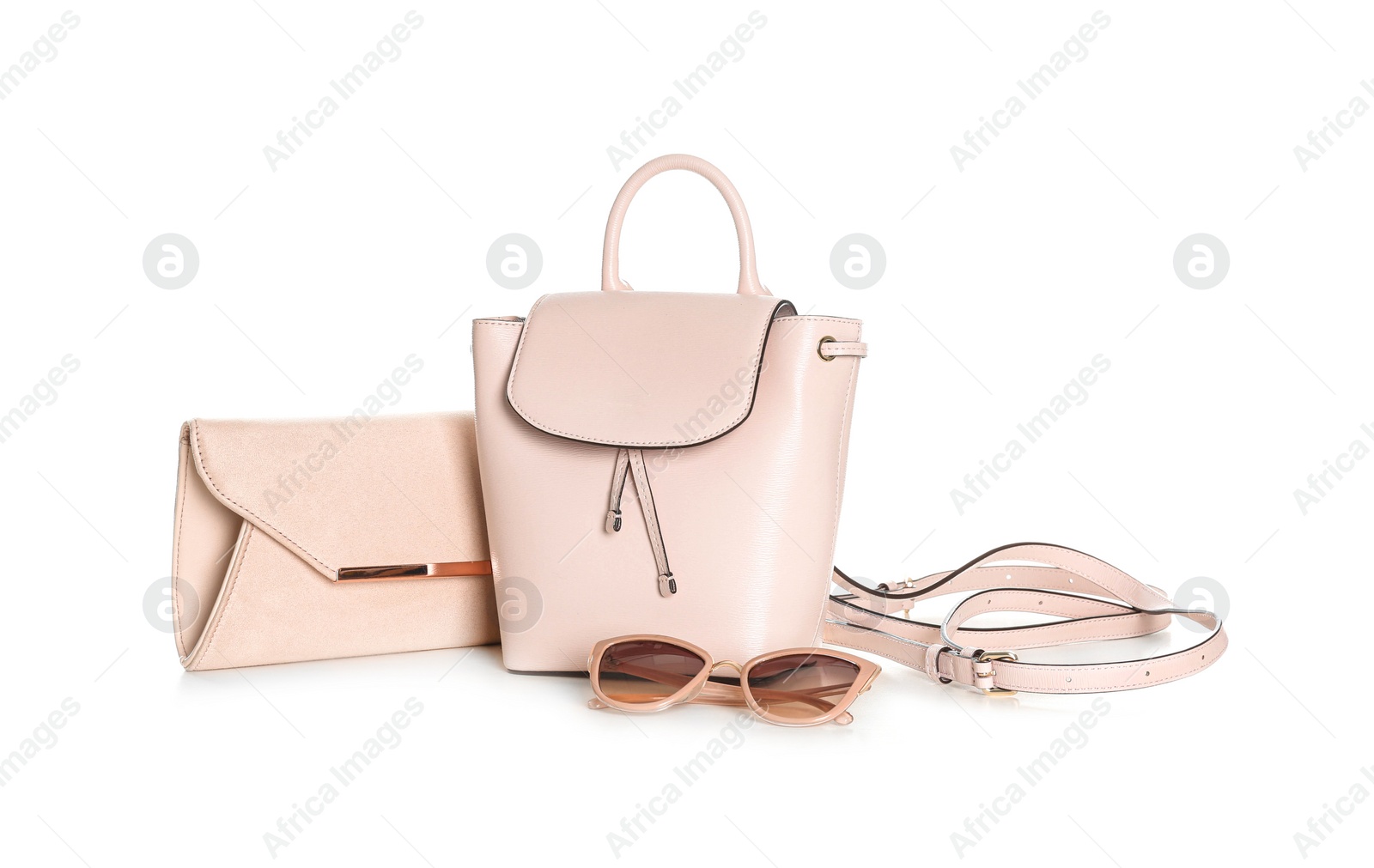 Photo of Different stylish woman's bags and sunglasses isolated on white