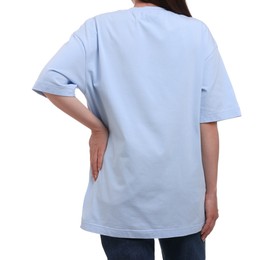 Woman in stylish light blue t-shirt on white background, back view